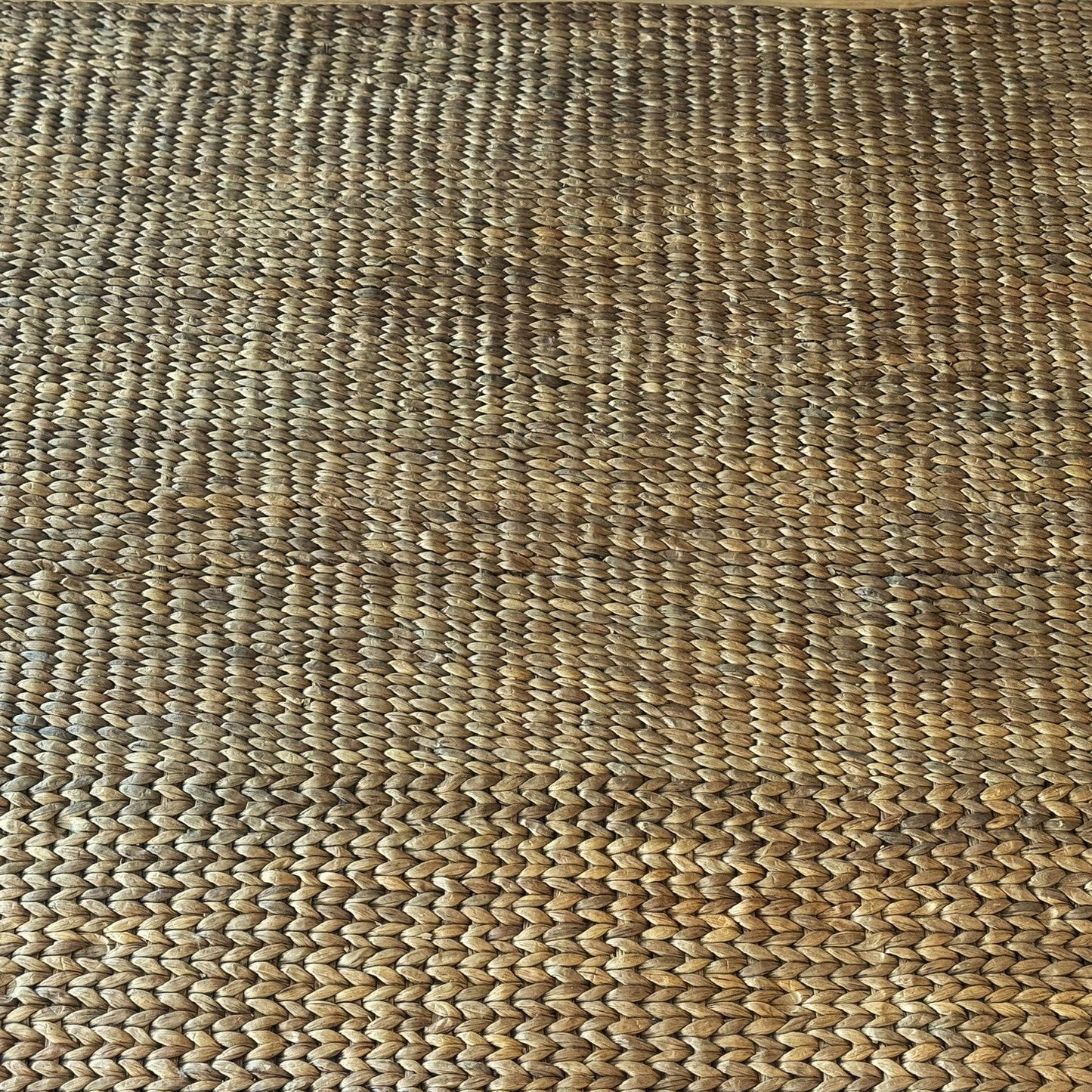 Close-up of a textured woven mat with a natural pattern