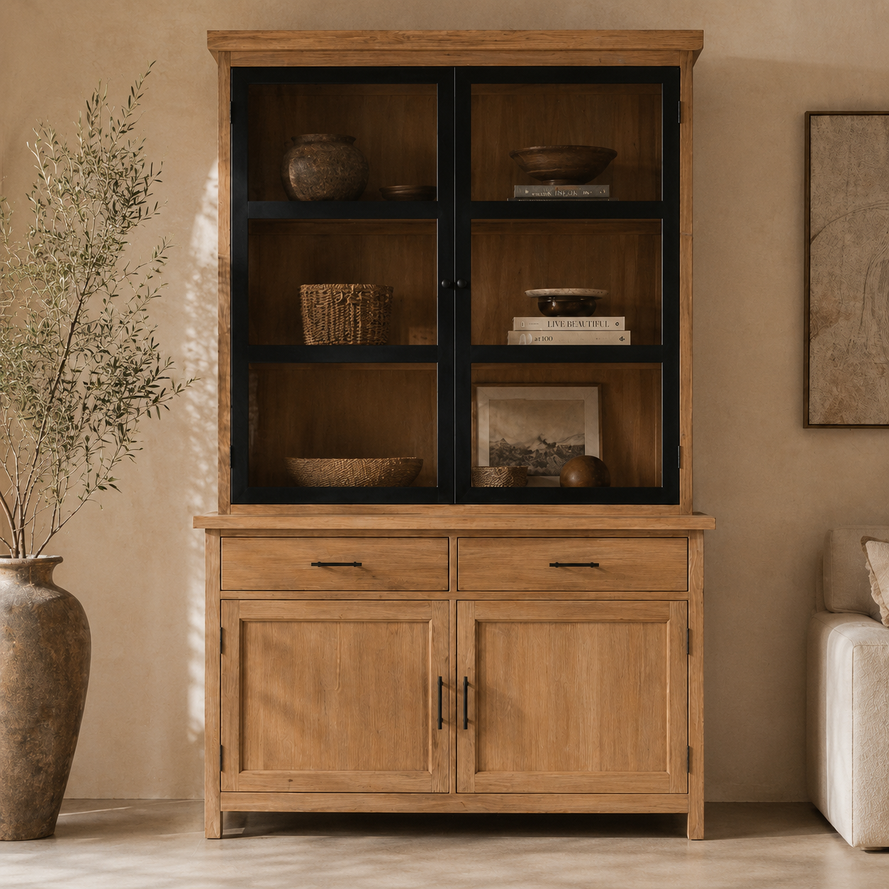 Wooden cabinet with glass doors and shelves in a living room setting.