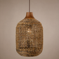 Woven rattan pendant light against a beige background