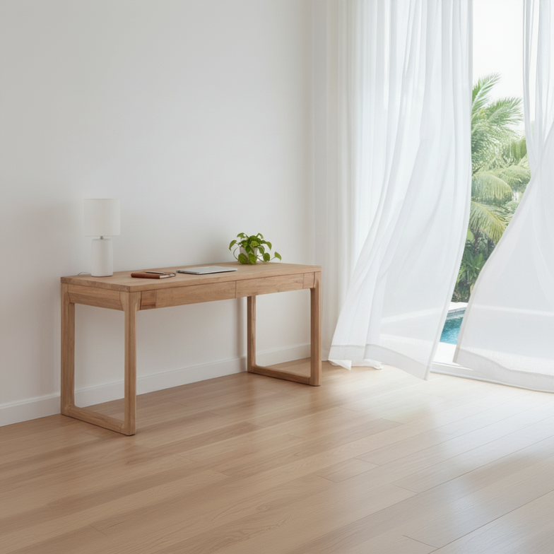 Wooden desk in a bright room with large windows and a view of greenery.