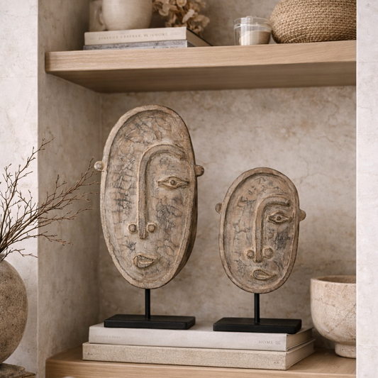 Decorative face masks on books with a neutral color palette