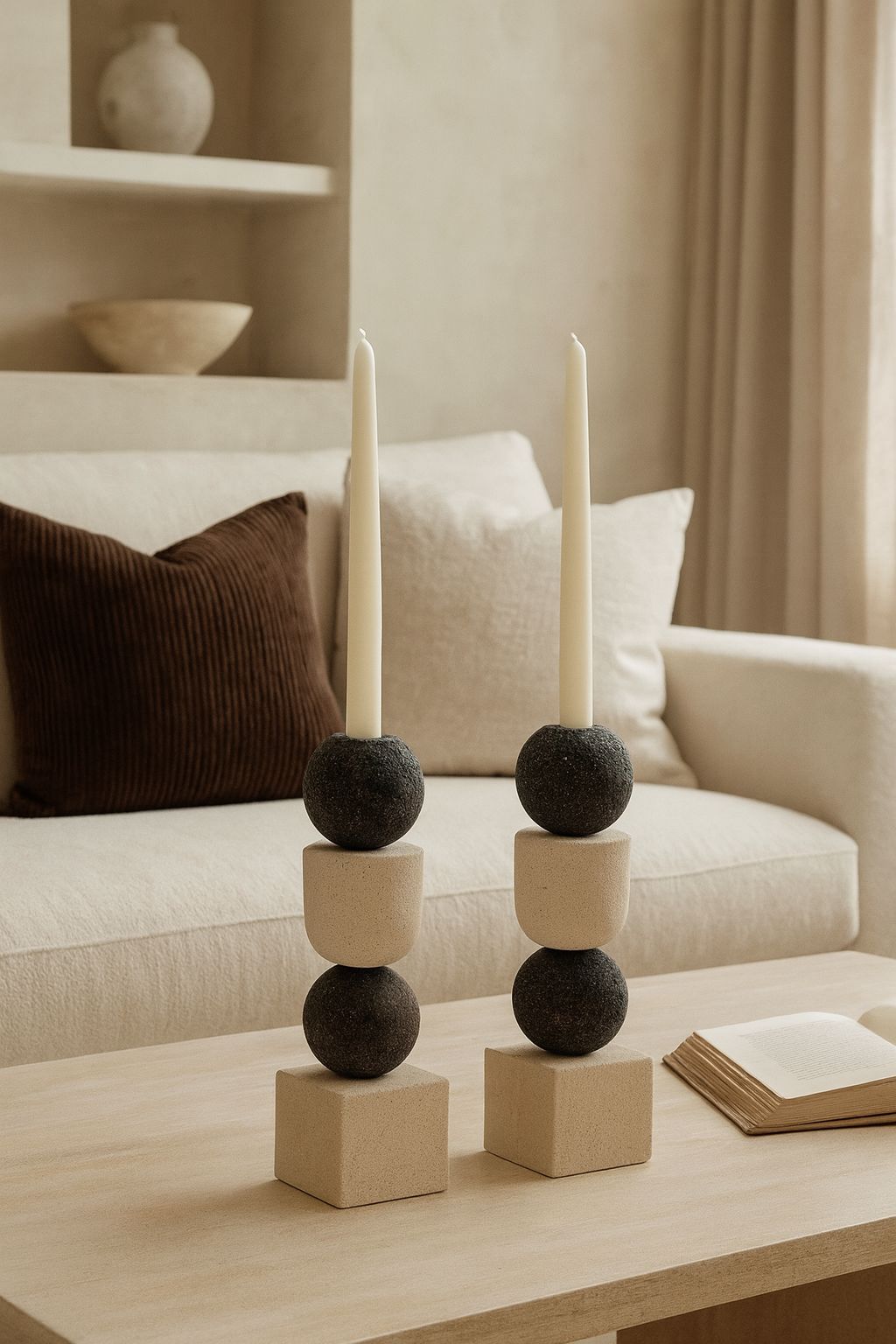 Decorative candle holder with candles on a coffee table in a living room setting. minimal