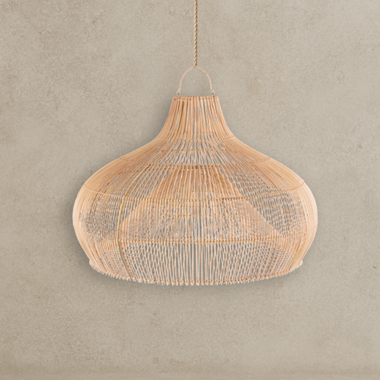 Woven pendant light hanging against a plain wall