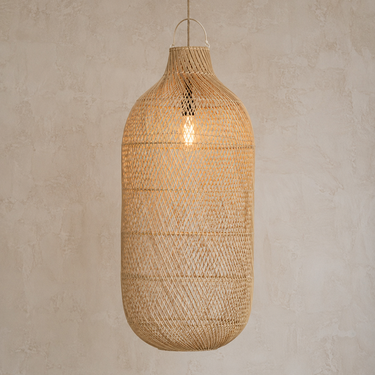 Woven rattan pendant light against a neutral wall