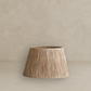 Wooden lampshade on a beige background