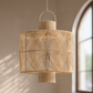 Woven pendant light fixture on a neutral background
