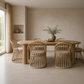 Dining room with wooden table and chairs in a neutral setting
