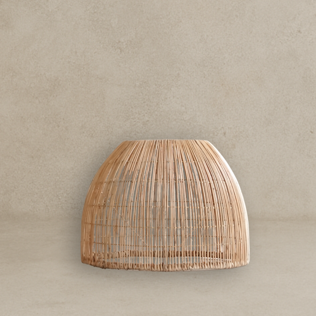 Woven rattan wall light fixture on a beige wall
